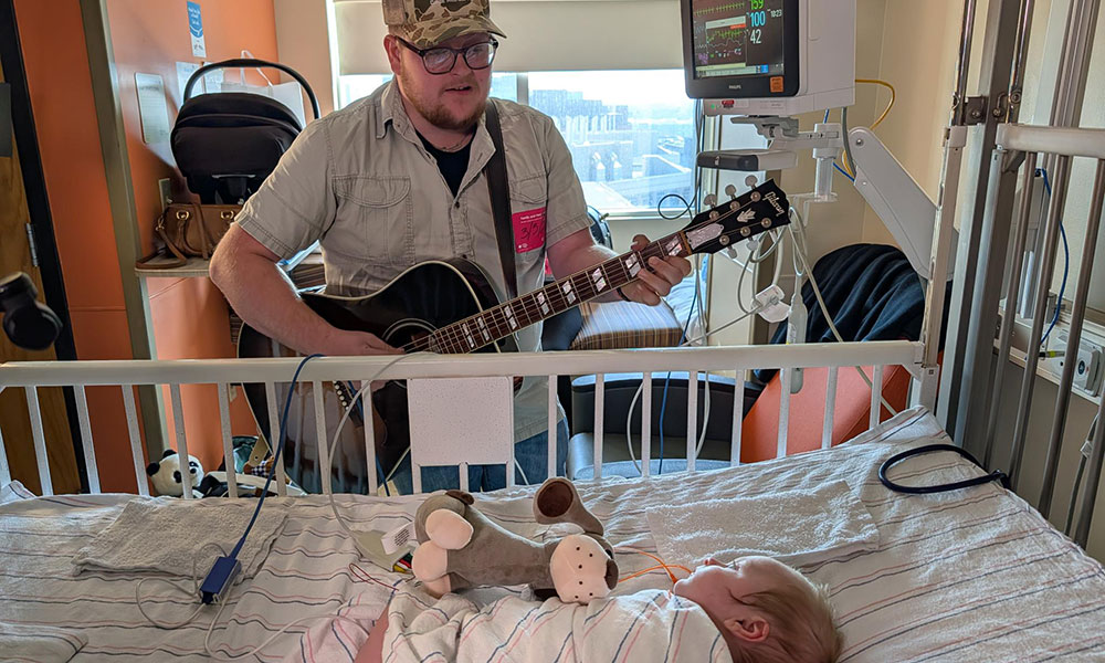 Christian Brown with his son, Isaiah, after the newborn had heart surgery
